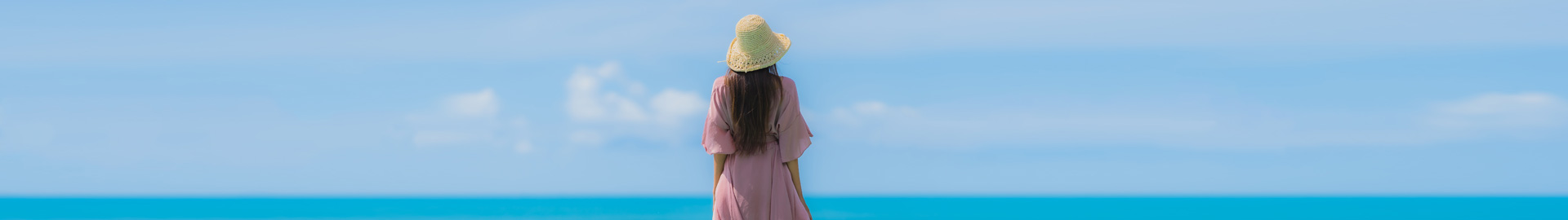 Girl standing at the ocean