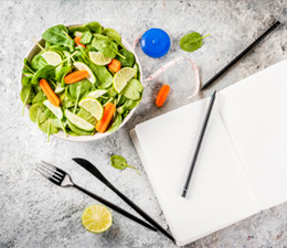 Picture of healthy food and book on a table